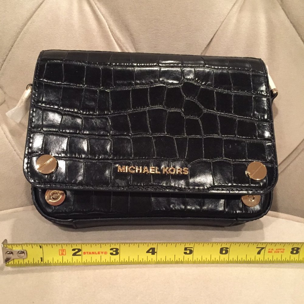 Michael Kohrs leather clutch with shoulder strap